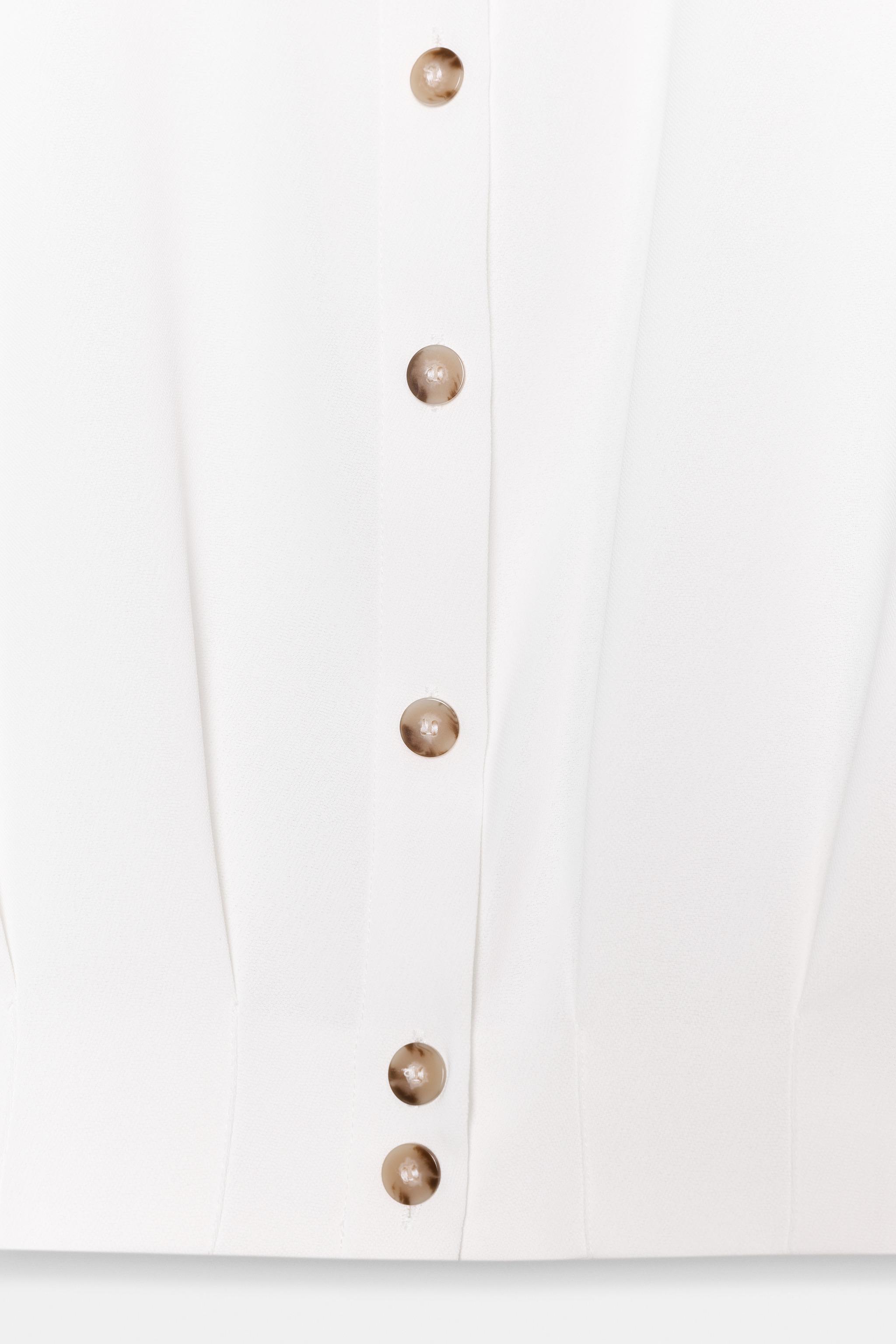 CHEMISE COURTE À PATTES D'ÉPAULES